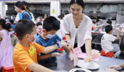 岭南师范学院工会举办庆“六一”手作良姜五黑丸亲子活动
